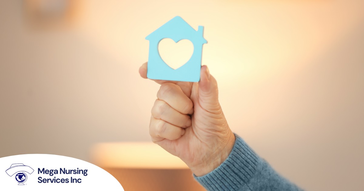 A hand holds up a cutout of a home with a heart in it, representing the home care industry.